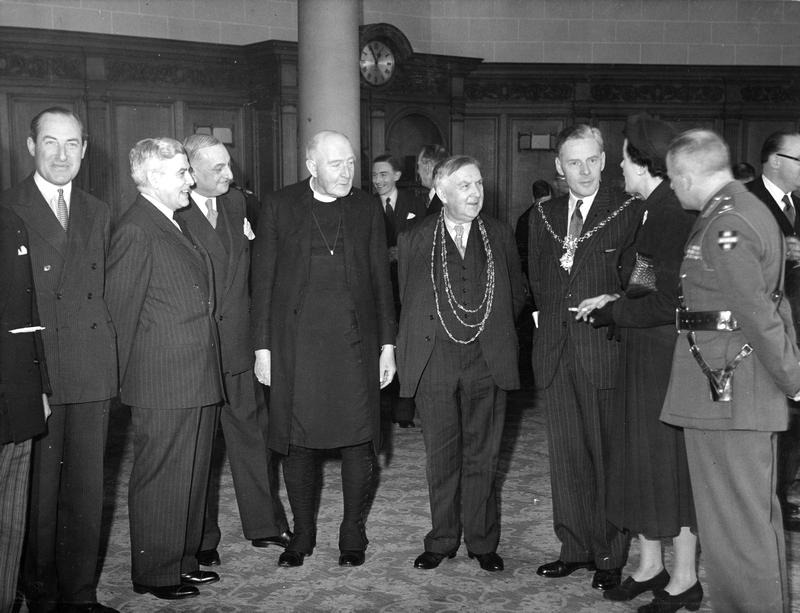 The Sheriff (Arthur Sykes Rymer) and Lord Mayor (J.B. Morrell) are pictured talking to guests after speeches marking their departure on a tour of Canada and America in 1950.