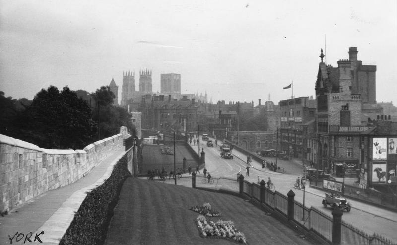 View from the city walls across Station Road and Lendal Bridge towards York Minster, 1920s.
