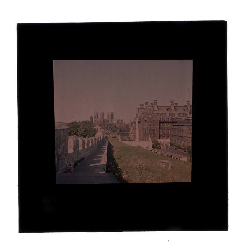 Colour lantern slide of the city walls looking towards the Minster, 1960s