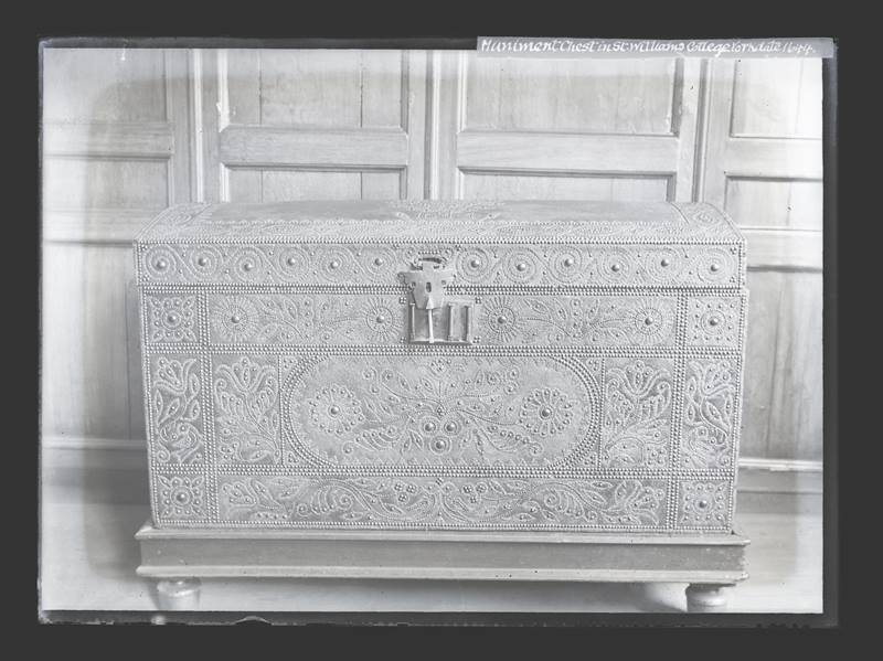 Decorative chest in a panelled room, c.1900